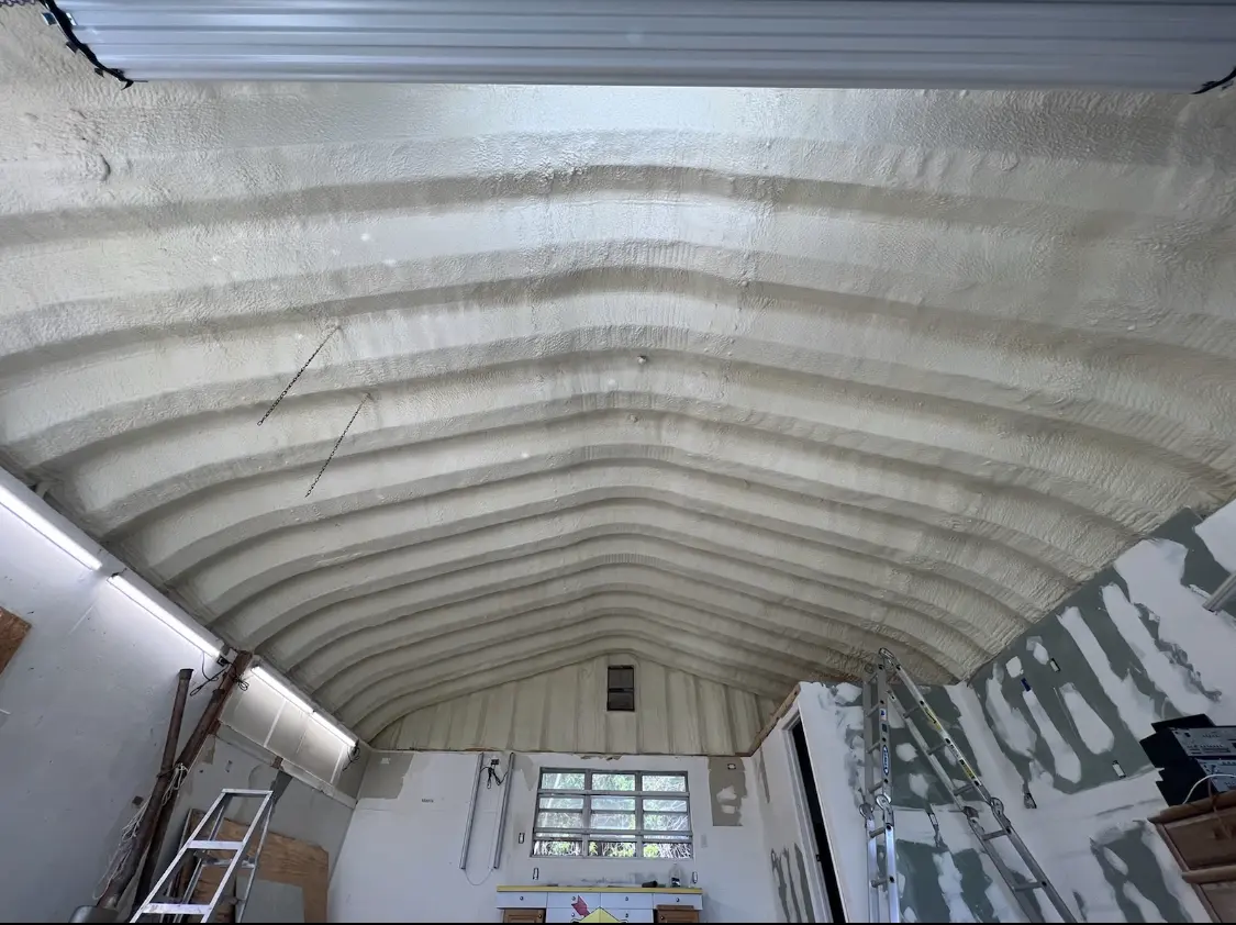 Spray polyurethane foam applied to the underside of a metal roof deck in East Pasadena